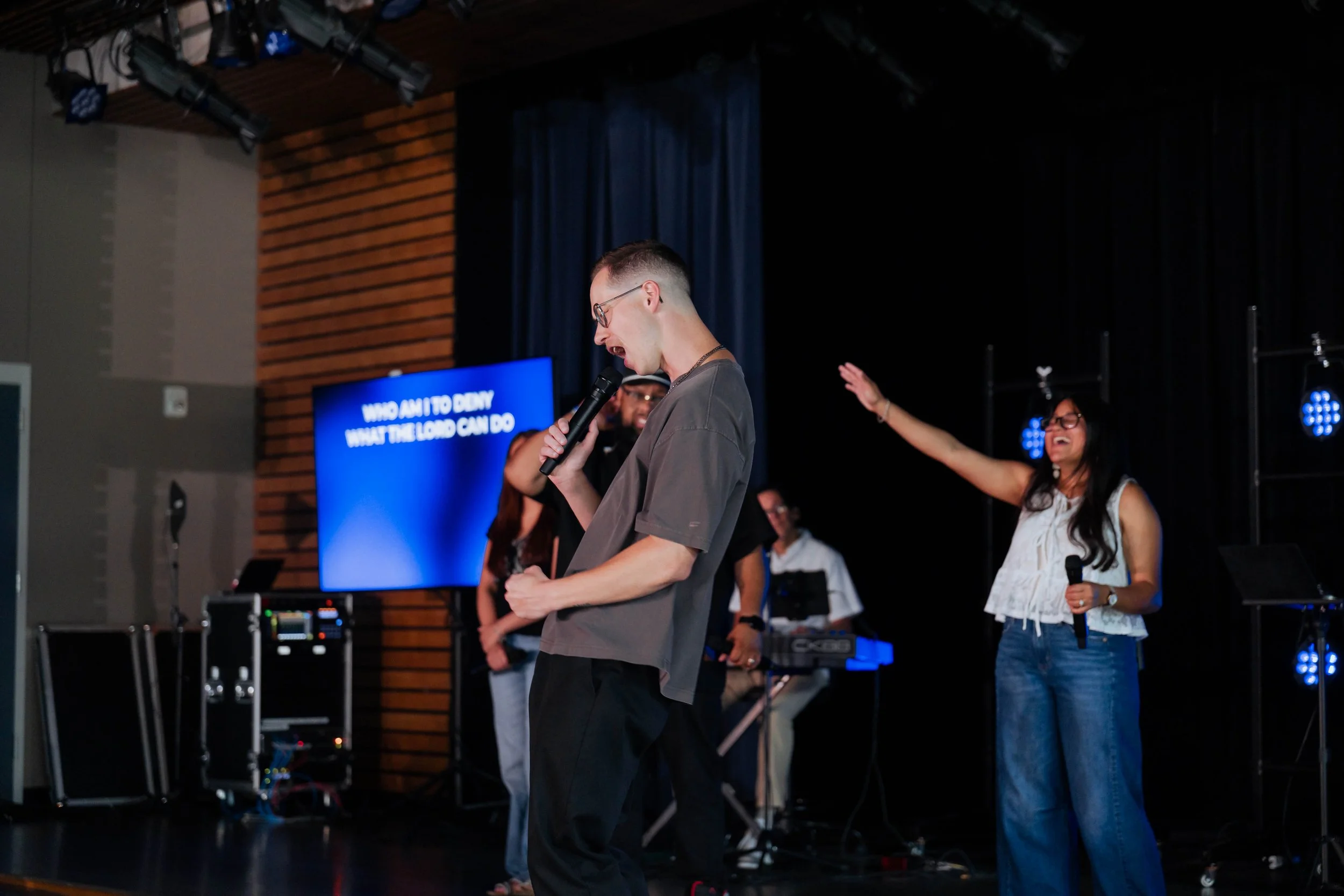 Brandon Garland preaching on stage